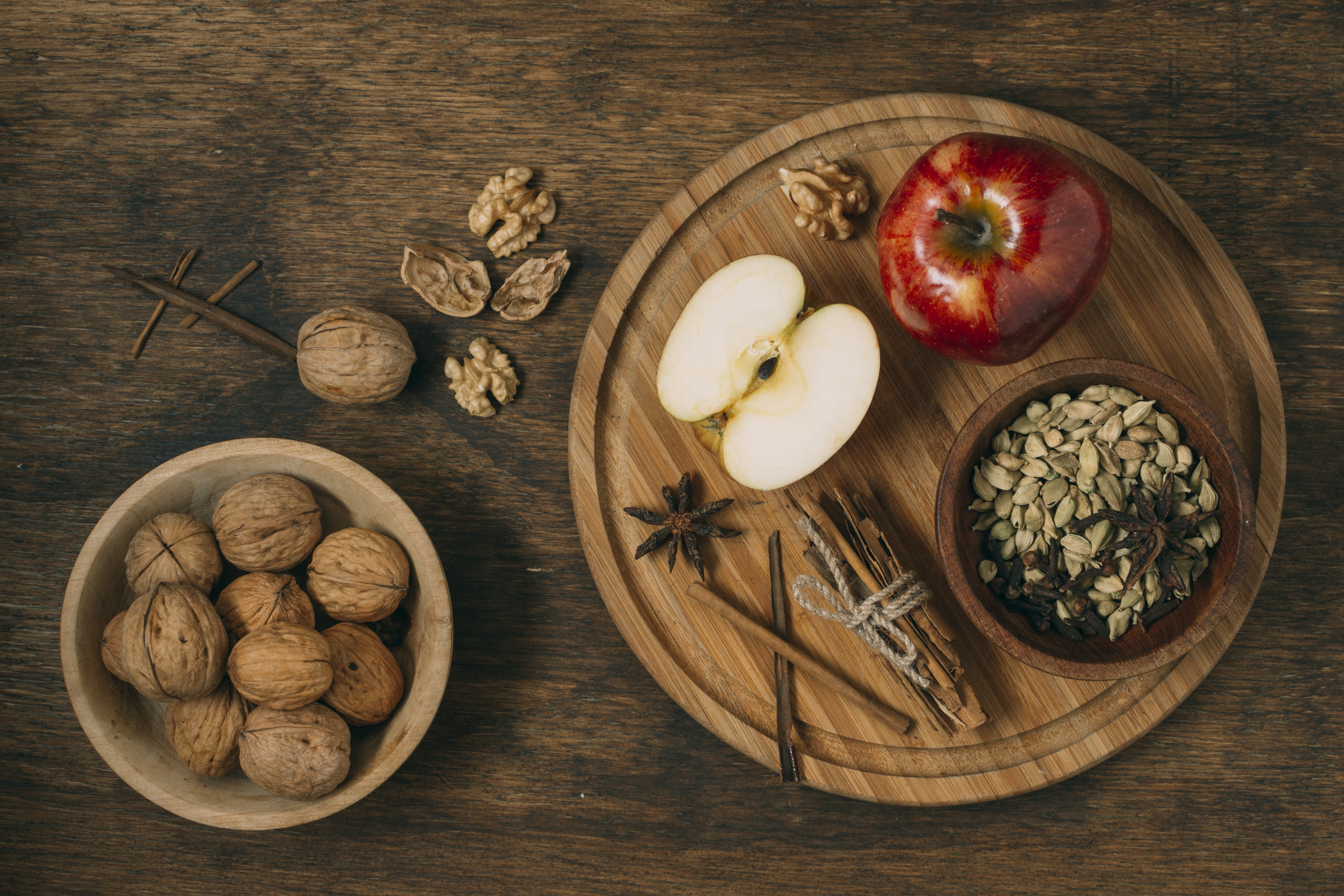 A weekly meal planning notebook surrounded by simple fresh ingredients